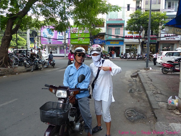 Single Woman Travels with Vietnamese style mask and scooter guide